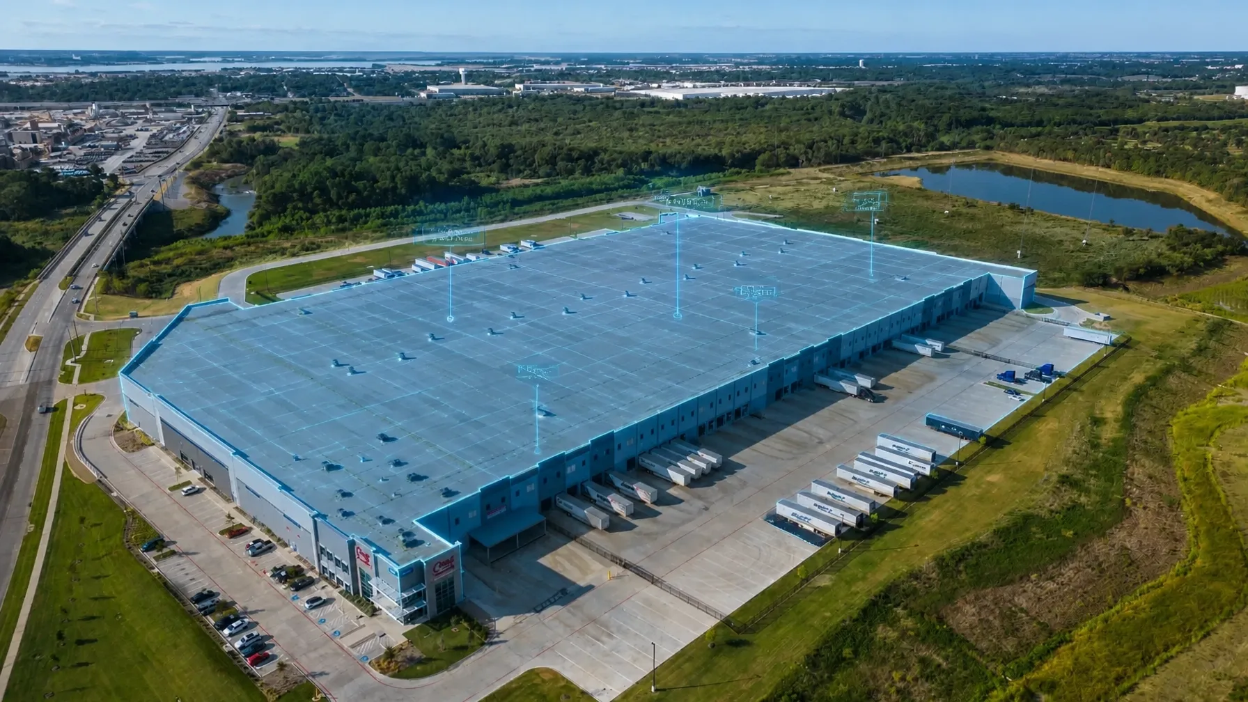 A digital twin overlay on a commercial industrial park, showing technical data points and a spatial grid for facility management.